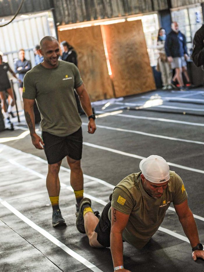 Stefan standing behind a training partner on the floor